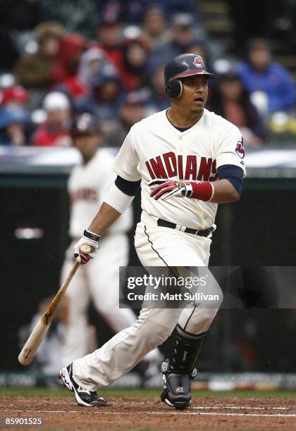 Victor Martinez of the Cleveland Indians hits a single against the Toronto Blue Jays in the first inning April 10, 2009 at Progressive Field in...