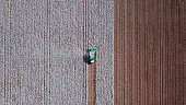 Aerial view of a Cotton picker working in a field.