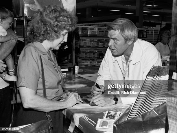 Singer/Songwriter Tom T. Hall signs autographs and meets with fans at Turtle's Records & Tapes in Atlanta Georgia April 03, 1985