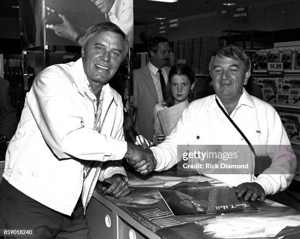 Singer/Songwriter Tom T. Hall signs autographs and meets with fans at Turtle's Records & Tapes in Atlanta Georgia April 03, 1985