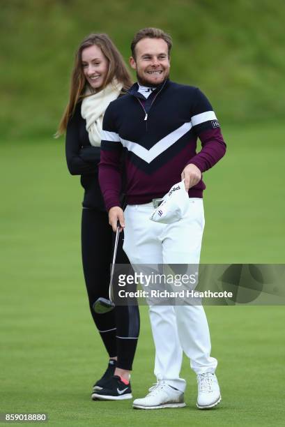 Tyrrell Hatton of England celebrates victory with his girlfriend, Emily Braisher following the final round of the 2017 Alfred Dunhill Championship at...