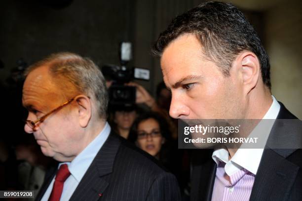 Alleged rogue trader Jerome Kerviel arrives with his lawyer Olivier Metzner for the second day of his trial at Paris courthouse on June 9 accused of...