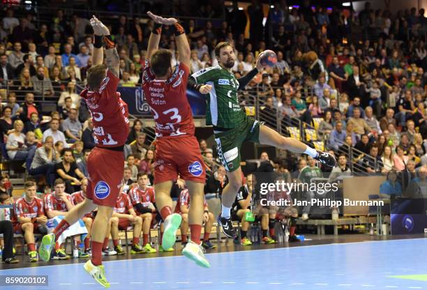 Christoph Theuerkauf, Tim Suton of TBV Lemgo and Fabian Wiede of Fuechse Berlin during the DKB HBL Bundesliga match between Fuechse Berlin and TBV...