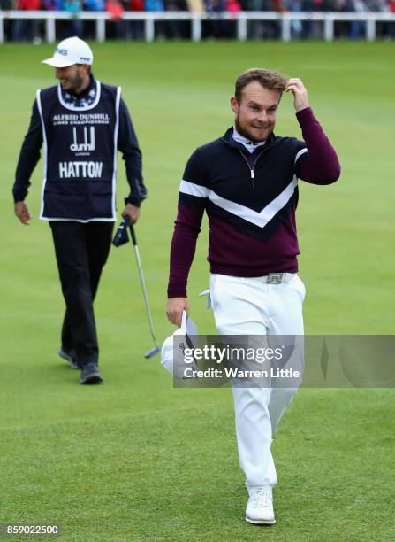 Tyrrell Hatton of England walks off the 18th green following victory in the final round of the 2017 Alfred Dunhill Championship at The Old Course on...