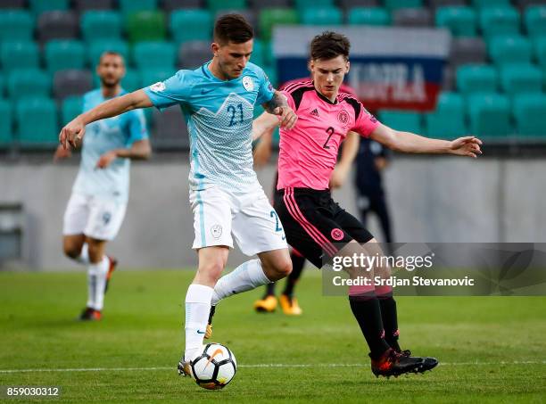 Benjamin Verbic of Slovenia in action against Kieran Tierney of Scotland during the FIFA 2018 World Cup Qualifier match between Slovenia and Scotland...