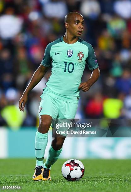 Joao Mario of Portugal runs with the ball during the FIFA 2018 World Cup Qualifier between Andorra and Portugal at the Estadi Nacional on October 7,...