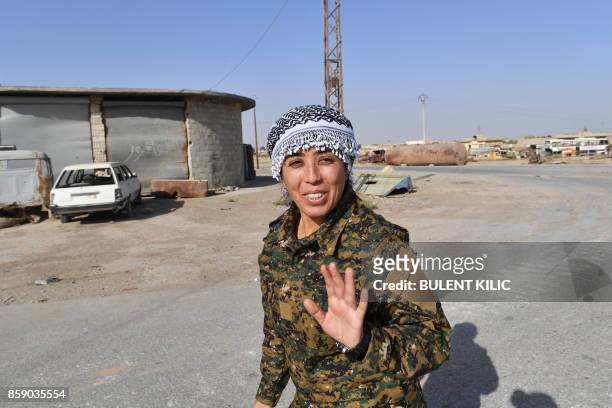 Rojda Felat, a Syrian Democratic Forces commander, speaks to an AFP journalist on the western frontline in Raqa on October 8, 2017. The SDF are...