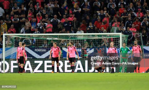 Scotland players appear dejected after Slovenia's Roman Bezjak scores his side's second goal of the game during the 2018 FIFA World Cup Qualifying...