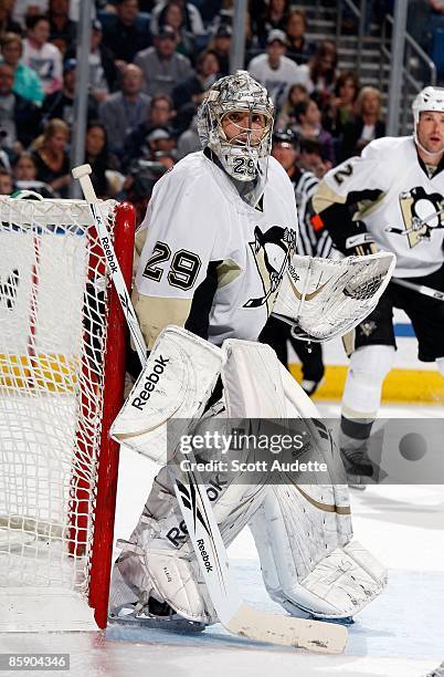 Goaltender Marc-Andre Fleury of the Pittsburgh Penguins defends the goal against the Tampa Bay Lightning at the St. Pete Times Forum on April 7, 2009...