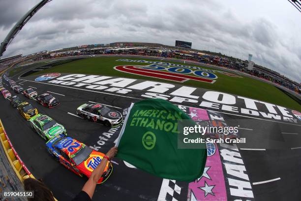 Matt Kenseth, driver of the Tide Pods Toyota, and Denny Hamlin, driver of the FedEx Office Toyota, lead the field at the start of the Monster Energy...