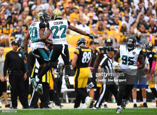 Jalen Ramsey of the Jacksonville Jaguars celebrates with Aaron Colvin after intercepting a pass intended for Vance McDonald of the Pittsburgh...