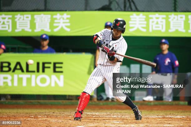 Shunta Tanaka of Japan hits a RBI single in the bottom half of the fifth inning during the 28th Asian Baseball Championship Final match between...