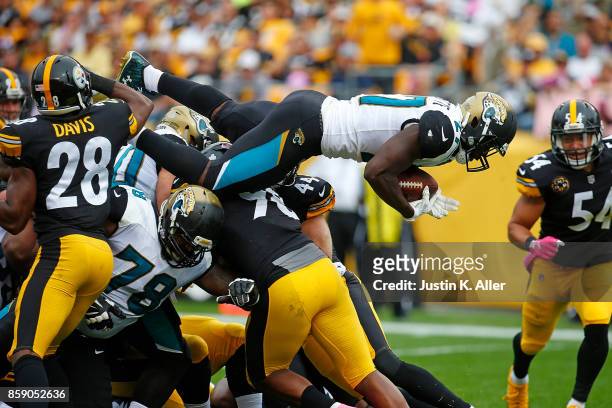 Leonard Fournette of the Jacksonville Jaguars dives into the end zone for a 2 yard touchdown in the second quarter during the game against the...