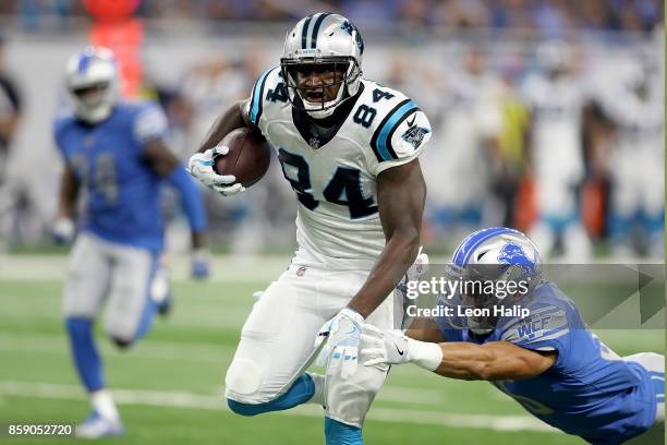 Ed Dickson of the Carolina Panthers fights off Miles Killebrew of the Detroit Lions during the first half at Ford Field on October 8, 2017 in...