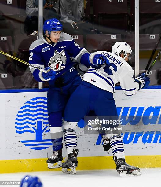 Austin Osmanski of the Mississauga Steelheads puts a hit on Blake Murray of the Sudbury Wolves during CHL game action on October 6, 2017 at Hershey...