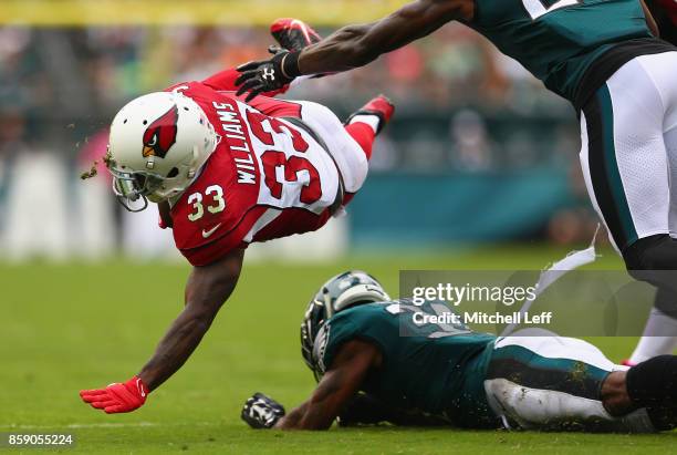 Jalen Mills of the Philadelphia Eagles tackles Kerwynn Williams of the Arizona Cardinals during the first half at Lincoln Financial Field on October...