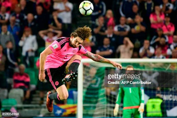 Scotland's Charlie Mulgrew kicks the ball during the FIFA World Cup 2018 qualifier football match between Slovenia and Scotland at the Stozice...