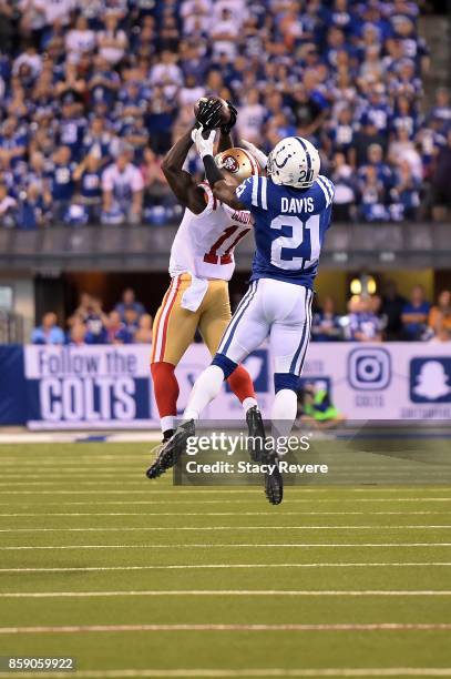 Marquise Goodwin of the San Francisco 49ers catches a pass in front of Vontae Davis of the Indianapolis Colts during the second quarter of a game at...