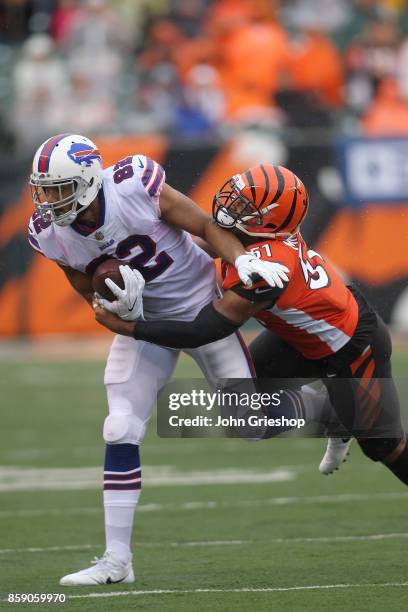 Kevin Minter of the Cincinnati Bengals tackles Logan Thomas of the Buffalo Bills during the second quarter at Paul Brown Stadium on October 8, 2017...