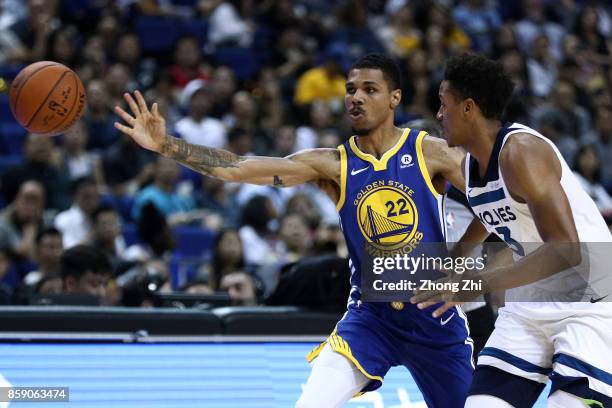 Michael Gbinije of the Golden State Warriors in action against Anthony Brown of the Minnesota Timberwolves during the game between the Minnesota...