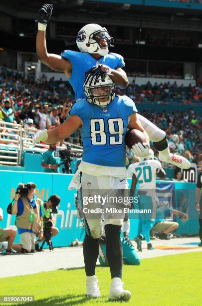 Phillip Supernaw celebrates with Rishard Matthews of the Tennessee Titans after completing a touchdown reception in the third quarter against the...