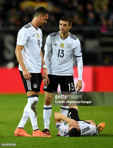 Shkodran Mustafi of Germany lies injury on the pitch during the FIFA 2018 World Cup Qualifier between Germany and Azerbaijan at Fritz-Walter-Stadion...