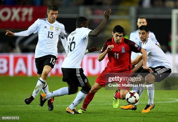 Thomas Mueller, Antonio Ruediger, Lars Stindl of Germany and Ramil Sheydaev of Azerbaijan battle for the ball during the FIFA 2018 World Cup...