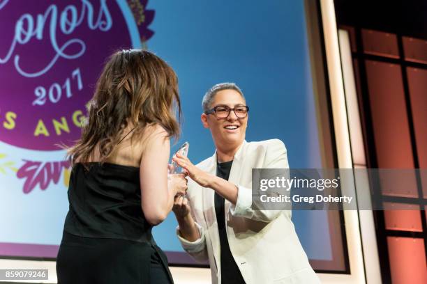 Actress Kathryn Hahn presents Honoree Jill Soloway accepts her Point Impact Award on stage at the Point Honors Los Angeles at The Beverly Hilton...