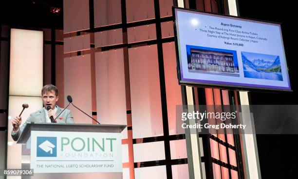 Auctioneer Gabriel Butu on stage at the Point Honors Los Angeles at The Beverly Hilton Hotel on October 7, 2017 in Beverly Hills, California.