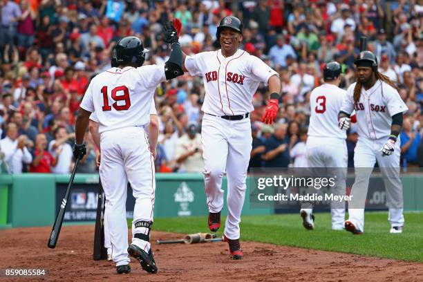 Rafael Devers of the Boston Red Sox celebrates with Jackie Bradley Jr. #19 after hitting a two-run home run in the third inning against the Houston...