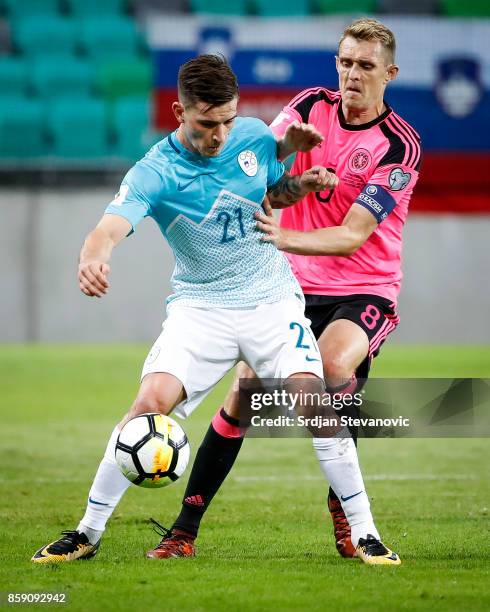 Benjamin Verbic of Slovenia is challenged by Darren Fletcher of Scotland during the FIFA 2018 World Cup Qualifier match between Slovenia and Scotland...