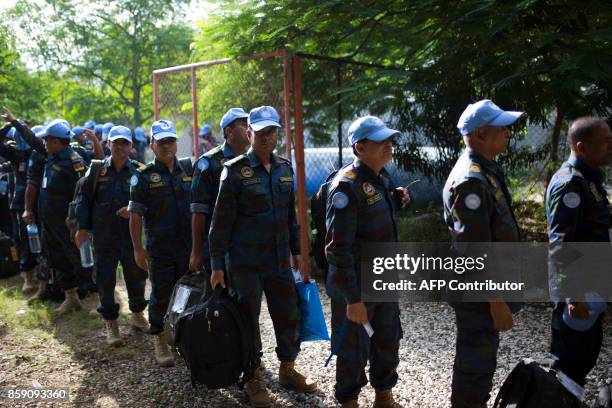 Bangladeshi peacekeepers of the United Nations Stabilization Mission in Haiti prepare to leave for Toussaint Louverture International Airport in...