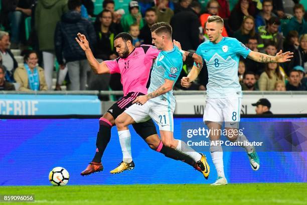 Scotland's Matthew Phillips vies with Benjamin Verbic of Slovenia during the FIFA World Cup 2018 qualification football match between Slovenia and...