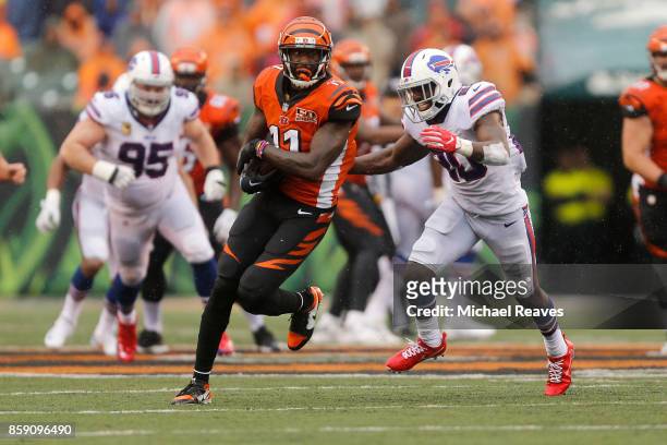 Brandon LaFell of the Cincinnati Bengals runs the ball upfield away from Shareece Wright of the Buffalo Bills during the fourth quarter at Paul Brown...