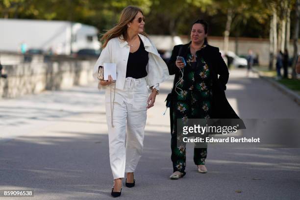 Guest wears a white jacket, outside Nina Ricci, during Paris Fashion Week Womenswear Spring/Summer 2018, on September 29, 2017 in Paris, France.