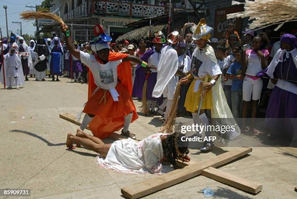 Group of actors perform the Via Crucis in the municipality of Livingston, Izabal, some 300 km north of Guatemala City, on April 10, 2009. Christians...