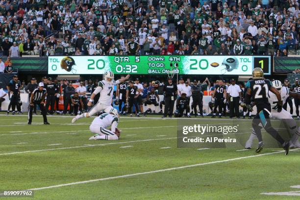 Kicker Chandler Catanzaro of the New York Jets kicks the game winning field goal in overtime against the Jacksonville Jaguars during their game at...