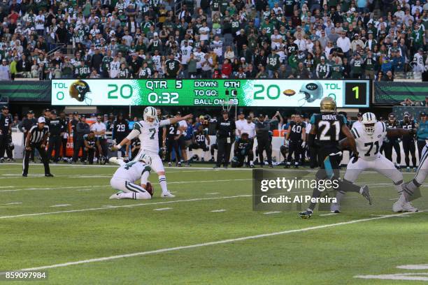 Kicker Chandler Catanzaro of the New York Jets kicks the game winning field goal in overtime against the Jacksonville Jaguars during their game at...