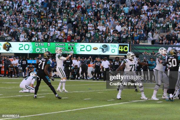 Kicker Chandler Catanzaro of the New York Jets kicks the game winning field goal in overtime against the Jacksonville Jaguars during their game at...