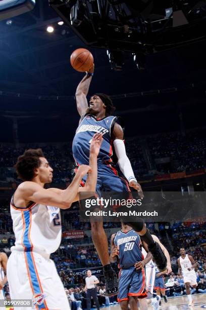 Gerald Wallace of the Charlotte Bobcats goes up for a dunk against Thabo Sefolosha of the Oklahoma City Thunder on April 10, 2009 at the Ford Center...