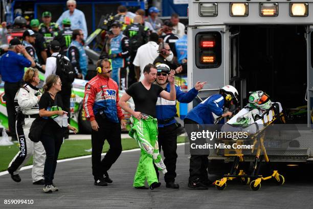 Kyle Busch, driver of the Interstate Batteries Toyota, is taken by amulance to the infield care center after finishing the Monster Energy NASCAR Cup...