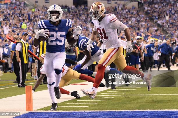 Marlon Mack of the Indianapolis Colts rushes for a touchdown against the San Francisco 49ers during the second half of a game at Lucas Oil Stadium on...