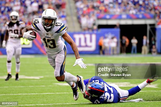 Keenan Allen of the Los Angeles Chargers escapes the tackle attempt of Darian Thompson of the New York Giants during the fourth quarter during an NFL...