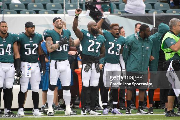 Eagles S Malcolm Jenkins , Eagles S Rodney McLeod , and Eagles DE Chris Long stand together during the National Anthem before the game between the...