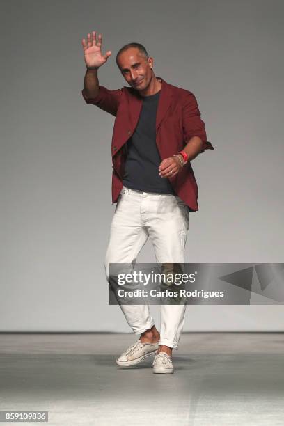 Designer Verissimo Mustra walks the catwalk during Mustra runway show on October 8, 2017 in Lisboa CDP, Portugal.