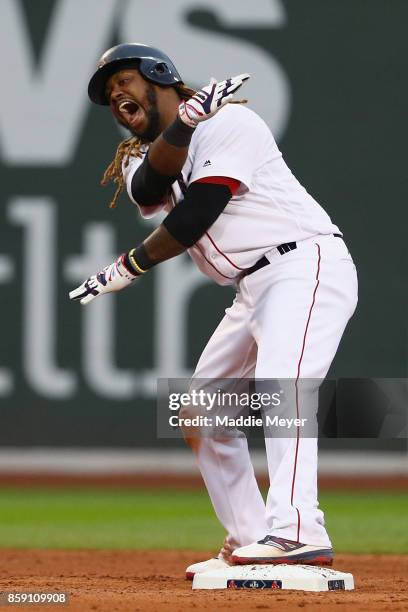 Hanley Ramirez of the Boston Red Sox celebrates after hitting a two-run RBI double in the seventh inning against the Houston Astros during game three...