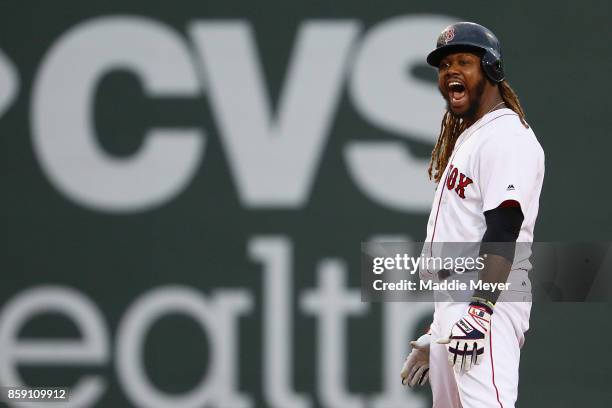 Hanley Ramirez of the Boston Red Sox celebrates after hitting a two-run RBI double in the seventh inning against the Houston Astros during game three...