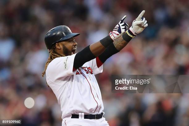 Hanley Ramirez of the Boston Red Sox celebrates after hitting a two-run RBI double in the seventh inning against the Houston Astros during game three...