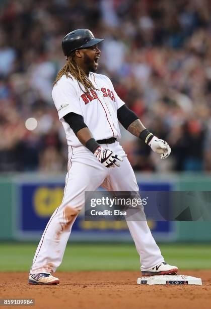 Hanley Ramirez of the Boston Red Sox celebrates after hitting a two-run RBI double in the seventh inning against the Houston Astros during game three...