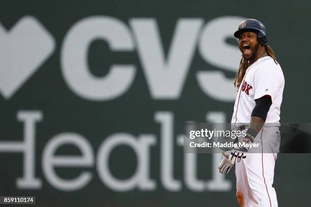 Hanley Ramirez of the Boston Red Sox celebrates after hitting a two-run RBI double in the seventh inning against the Houston Astros during game three...